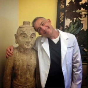 dr kroner withh acupuncture antique statue